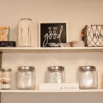 Shelves holding jars and signs